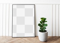 Picture frame mockup by a fiddle-leaf fig plant on a parquet floor