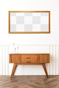 Picture frame mockup over a wooden sideboard table with taper candle holders 