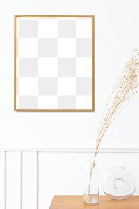 Picture frame mockup over a wooden sideboard table with dried flowers in a vase 
