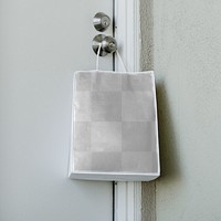 Contactless delivery bag hanging on a doorknob