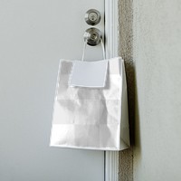 Contactless delivery bag hanging on a doorknob