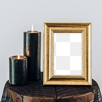 Black lighted candles by a golden picture frame mockup 