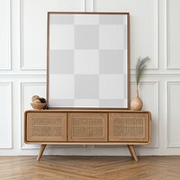 Picture frame mockup png on a rattan cabinet