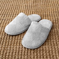 Indoor slippers mockup png on jute rug