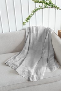 Throw blanket png transparent on a sofa