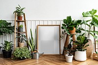 Picture frame mockup transparent png by a houseplant corner on a parquet floor