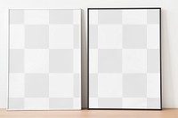 Black picture frame png mockup leaning against white wall