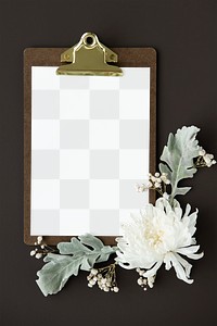 White chrysanthemum flower on a paper mockup attactched to a clipboard 