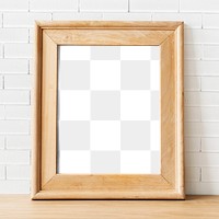 Brown wooden frame png mockup by a wall