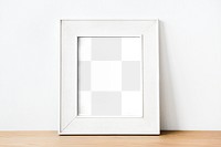 White wooden frame png mockup by a wall