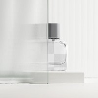 Png perfume bottle mockup with patterned glass texture product backdrop