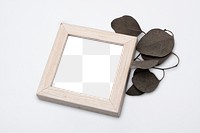 Wooden picture frame mockup png with aesthetic dried leaf