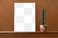 Canvas png mockup on a shelf with a cactus
