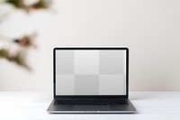 Transparent laptop screen png mockup, minimal workspace with blurred green leaf