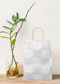 Shopping bag mockup png, vase with houseplant on the side