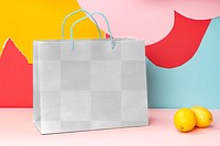 Shopping bag png mockup, fashion branding with colorful background