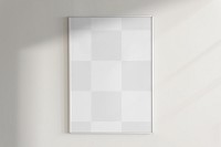 Frame mockup png on a wall with natural light