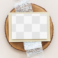 Card mockup with beige envelope on a wooden plate