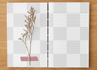 Dried flower on a blank lined notebook design element