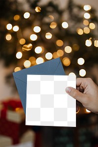Hand holding Christmas card transparent png