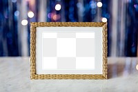 Golden frame mockup on a table transparent png 