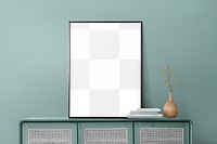 Picture frame png mockup leaning on a mint green wall in a living room