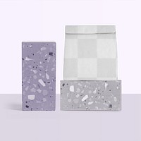 Png reusable paper bag mockup rolled up in terrazzo pattern