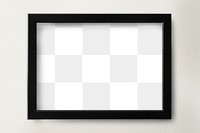 Black picture frame mockup on a wall 