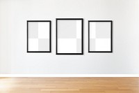 Black picture frame mockups hanging on an off white wall