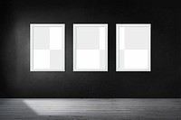 White picture frame mockups hanging on a black wall
