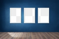 White picture frame mockups hanging on a dark blue wall