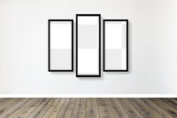 Black picture frame mockups hanging on an off white wall