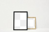 Black and beige picture frame mockup leaning against a white wall