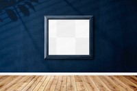 Bluish gray picture frame mockup hanging on a blue wall