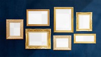 Luxurious baroque frame mockups hanging on a dark blue wall