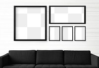 5 blank black picture frames hanging in a white living room