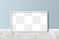 White picture frame mockup against a gray wall