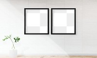 Two blank black frames mockup on an off white wall
