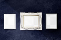 White picture frame mockup hanging on a blue wall