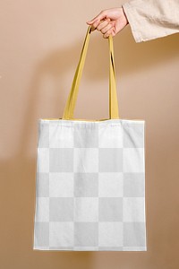 Woman holding a tote bag mockup in her hand