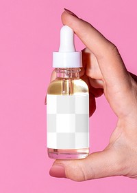 Woman holding a skin care dropper bottle mockup 