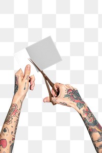Hands with tattooed holding scissors cutting paper transparent png