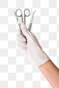 Gloved hand holding stainless steel medical instruments