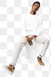 Man png mockup in white sweater and pants sitting on a chair street fashion full body