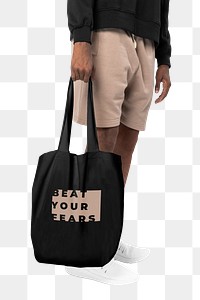 Png man mockup carrying black tote bag beat your fears inspirational quote