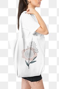 Png woman mockup carrying white tote bag with floral design