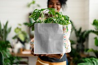 shopping bag mockup with plant inside eco-friendly shop