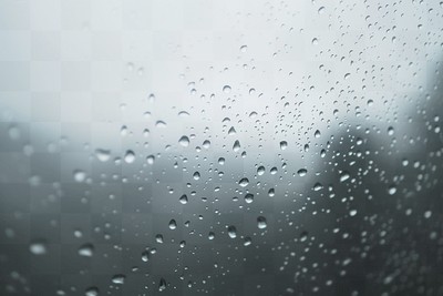 PNG Raindrops dripping on glass background water atmosphere.