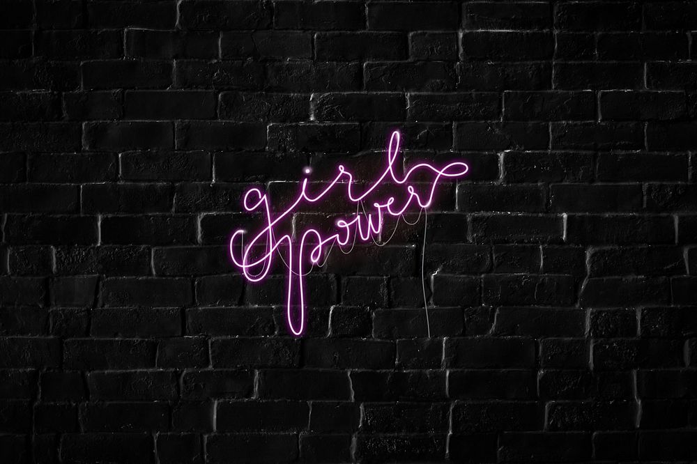 Girl power neon sign background, black brick wall