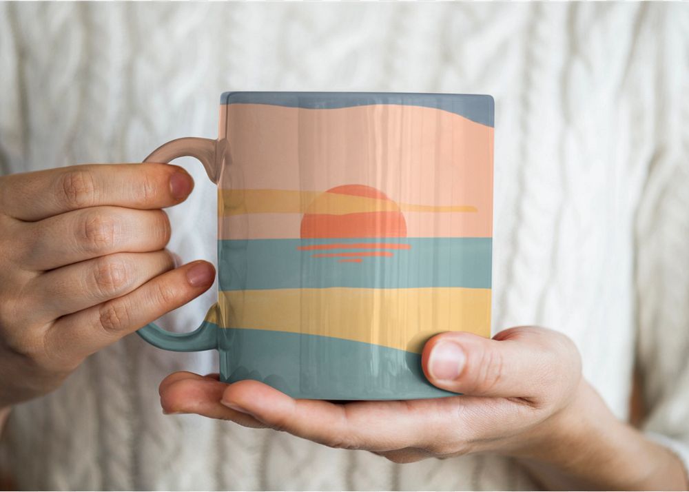 Woman holding a sunset mug